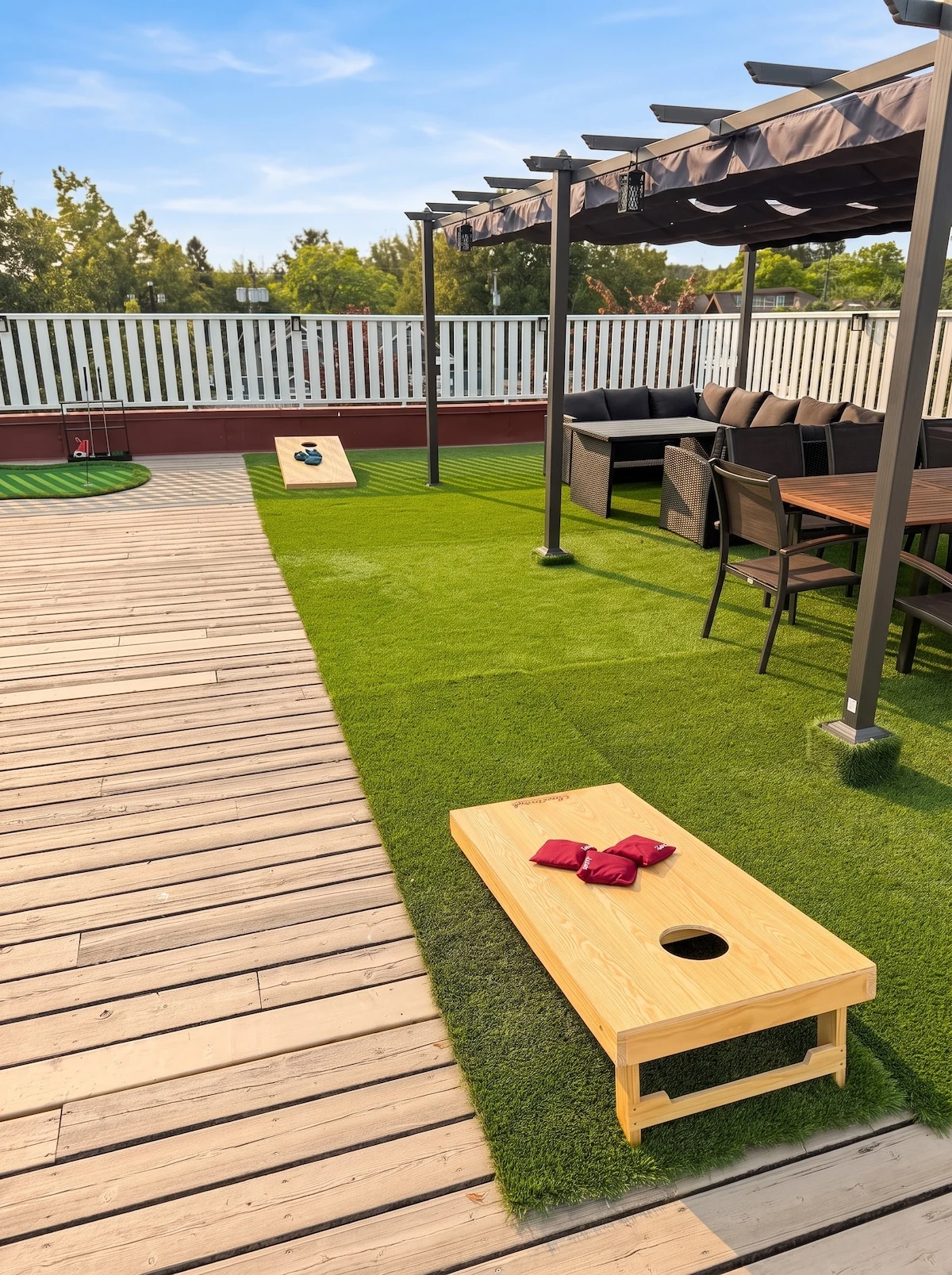 Cornhole boards and putting green on the rooftop